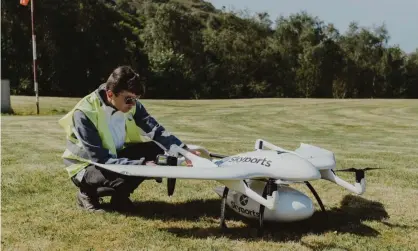  ??  ?? A Skyports worker with a delivery drone on the Isle of Mull. The aircraft can provide NHS workers with PPE and other supplies. Photograph: Skyports