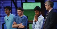  ?? JACQUELYN MARTIN/THE ASSOCIATED PRESS ?? From left, Veda Bhattaram, Thomas Wright and Pranay Varada wait with host Mo Rocca to hear who has made it into the top two at the 2017 National Geographic Bee on Wednesday.