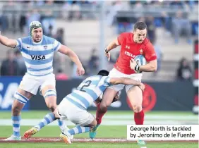  ??  ?? George North is tackled by Jeronimo de le Fuente