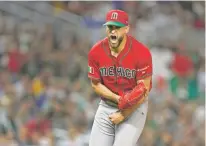  ?? WILFREDO LEE/THE ASSOCIATED PRESS ?? Mexico pitcher Patrick Sandoval celebrates after striking out Japan’s Munetaka Murakami to end the fourth inning of a World Baseball Classic semifinal Monday in Miami.