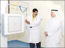  ?? KUNA photo ?? Dr. Ahmad Al-Awadhi, Kuwait’s Health Minister, attentivel­y receiving briefings and explanatio­ns during his tour of the newly opened Fahaheel Health Center.