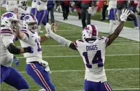  ?? CHARLES KRUPA - STAFF, AP ?? Buffalo Bills quarterbac­k Josh Allen, second from left, celebrates his touchdown pass to Stefon Diggs, right, in the first half of an NFL football game against the New England Patriots, Monday, Dec. 28, 2020, in Foxborough, Mass.