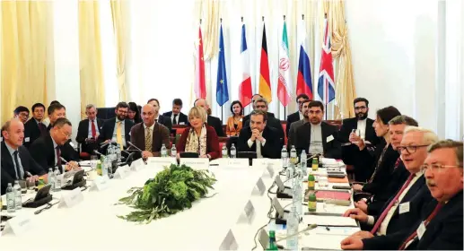  ?? (Leonhard Foeger/Reuters) ?? IRAN’S TOP NUCLEAR negotiator Abbas Araqchi and Secretary General of the European External Action Service (EEAS) Helga Schmit attend a meeting of the JCPOA Joint Commission in Vienna, Austria, last month.