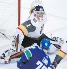  ??  ?? Lantzville's Dylan Ferguson, minding the net for the Las Vegas Knights, stops Vancouver Canucks’ right-winger Kole Lind in a preseason NHL game in Vancouver.