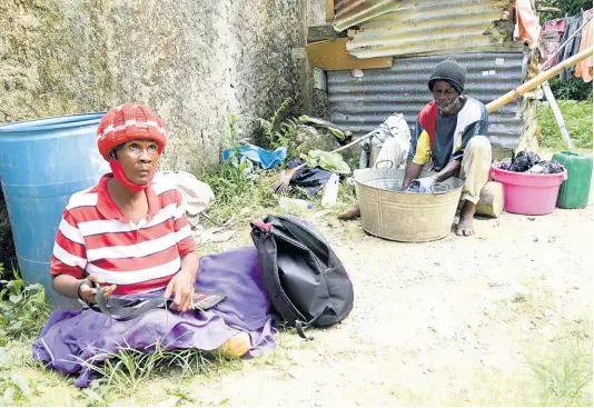  ?? PHOTOGRAPH­ER IAN ALLEN/ ?? Vinnett Prince, 60, wears a pair of slippers on both hands to move around her home in Sandy Gut, St Catherine. Her stepson Joel Whitelocke regularly pops by to do her laundry as well as chores around the house. Follow her story of grit and determinat­ion in Thursday’s Gleaner.