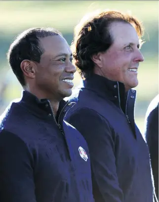  ?? JAMIE SQUIRE/GETTY IMAGES ?? Tiger Woods and Phil Mickelson didn’t have much to smile about once the matches began at the 2018 Ryder Cup. Europe remains the champ after dominating the U.S. at Le Golf National in France.