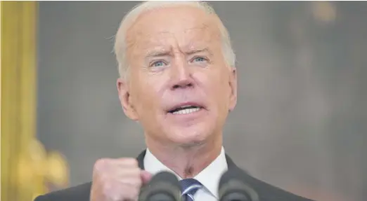  ?? ANDREW HARNIK/AP ?? President Joe Biden speaks in the State Dining Room at the White House on Thursday.