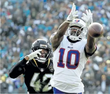  ?? MIKE EHRMANN/ GETTY IMAGES ?? Buffalo wide receiver Deonte Thompson misses a fourth- quarter pass during a 10- 3 loss to the Jaguars in the AFC wild- card game on Sunday in Jacksonvil­le.