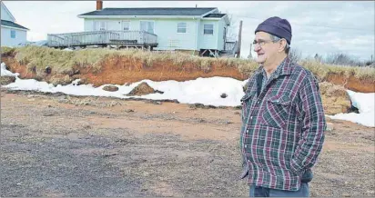  ?? ERIC MCCARTHY/TC MEDIA ?? David Haley scours the shoreline in front of his Lennox Island home. It’s just a few metres from Malpeque Bay and, like many properties on Lennox Island, could be threatened by the next big storm surge.