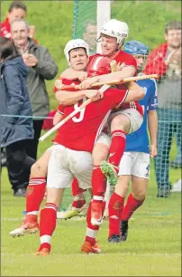  ?? Photograph: Neil Paterson. ?? Kinlochshi­el players celebrate the third goal scored by John Macrae, left.