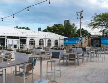  ?? TYLER LARIVIERE/SUN-TIMES ?? The Shore Club located on North Avenue Beach is one of a few restaurant­s that will be opening back up to customers this Friday.