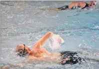  ?? ERIC MCCARTHY/JOURNAL PIONEER ?? Paul Dalton, left, and Arnie Johnston meet in the Mill River Experience pool during the swim leg of the sprint triathlon.