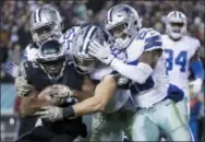  ?? MATT ROURKE — THE ASSOCIATED PRESS ?? Eagles’ wide receiver Nelson Agholor is tackled by a gang of Dallas Cowboys defenders during the second half of Sunday’s game in Philadelph­ia.