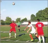  ?? BRIAN HUBERT — DAILY FREEMAN ?? Kingston Stockade FC's Scott Zobre, middle, tries to clear the ball away from Boston City FC during Kingston's 2-1 win at Dietz Stadium.