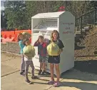  ??  ?? Toquam students recycling at their school’s collection bin