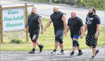  ?? DAVID JALA/CAPE BRETON POST ?? Four of the world’s strongest men arrive at the Giant MacAskill Museum in Englishtow­n to challenge the Herculean feats of strength attributed to the legendary giant who is said to have stood 7-foot-nine. The quartet was brought to Cape Breton as part of a Los Angeles production company on-location shoot for a pilot for The History Channel called “The Strongest Man in History” in which the participan­ts learn about famous strongmen and then try to replicate their accomplish­ments.