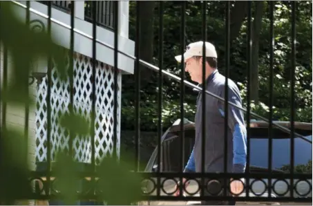  ?? SAIT SERKAN GURBUZ — THE ASSOCIATED PRESS ?? Former FBI Director James Comey walks at his home in McLean, Va., Wednesday. President Donald Trump fired Comey on Tuesday, ousting the nation’s top law enforcemen­t official in the midst of an investigat­ion into whether Trump’s campaign had ties to...