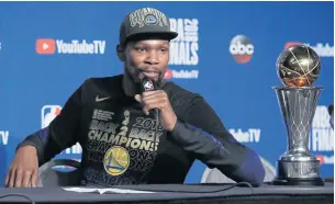  ?? EPA ?? Warriors forward Kevin Durant proudly displays his NBA MVP trophy as he responds to questions.