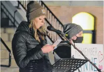  ?? STU NEATBY/THE GUARDIAN ?? Courtney Crosby speaks at a mental health protest outside of the Coles Building in Charlottet­own on Tuesday, next to her son Landon Richardson, who is 12. Crosby said mental health services have grown worse in P.E.I. in the midst of the COVID-19 pandemic.
