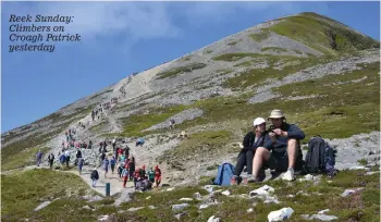  ?? ?? Reek Sunday: Climbers on Croagh Patrick yesterday