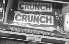  ??  ?? Nestle Crunch bars are seen on a store shelf, the day the company announced plans to sell its US candy business in Miami, Florida. Nestle has agreed to sell its US confection­ery business to Italy’s Ferrero for US$2.8 billion. — AFP photo