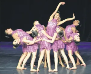  ?? NIKKI SULLIVAN/CAPE BRETON POST ?? Ally Martin dances in the middle of her group from Lucy Wintermans School of Dance during their large group lyrical performanc­e ages 9-10. The piece, Everywhere, received gold and top marks in the category.