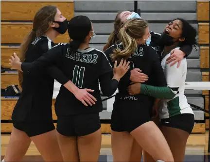  ?? PHOTOS BY DREW ELLIS — MEDIANEWS GROUP ?? West Bloomfield celebrates after securing a five-set win over Bloomfield Hills during their D1 district match at Waterford Mott on Monday.