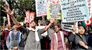  ?? — PTI ?? The Delhi University Teachers’ Associatio­n, along with other college teachers’ unions stage a protest against Delhi government in New Delhi on Friday.