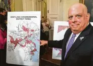  ?? Michael Dresser / TNS ?? Maryland Gov. Larry Hogan points to a map of the state’s 3rd Congressio­nal District, considered among the most gerrymande­red in the country.