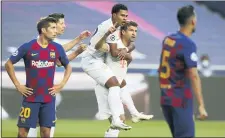  ?? RAFAEL MARCHANTE — THE ASSOCIATED PRESS ?? Bayern’s Thomas Mueller, bottom center, celebrates after scoring the opening goal during Friday’s Champions League quarterfin­al match between Barcelona and Bayern Munich.