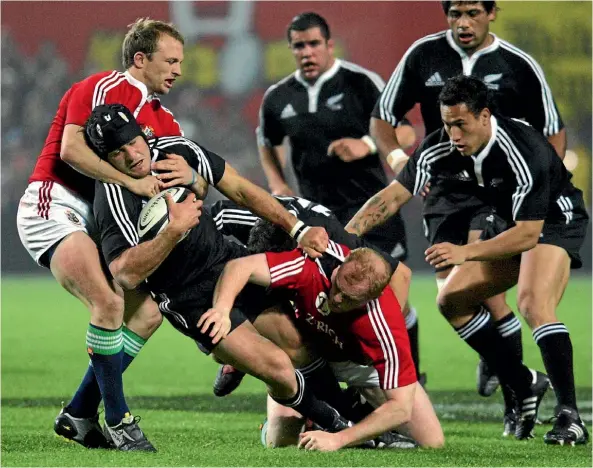  ??  ?? Marty Holah is tackled by Matt Dawson during the famous 19-13 Maori win over the Lions in Hamilton in 2005.