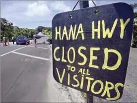  ?? The Maui News MATTHEW THAYER photo ?? A roadblock at Twin Falls is shown
last month. The state plans to reinstate full access to the road to Hana on Wednesday. Access to East Maui has been limited since March over concerns of COVID-19 spread.