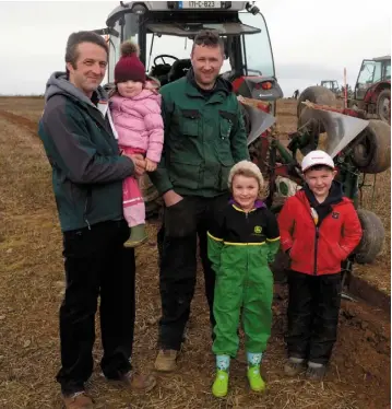  ?? PHOTO: DENIS BOYLE ?? Andrew, Andrea and Emily Dean and Liam and Micheal O’Driscoll enjoy the annual ploughing match in Kilbrittai­n, Co Cork.