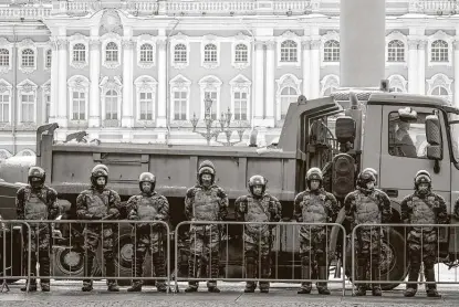  ?? Dmitri Lovetsky / Associated Press ?? Russian soldiers block the entrance to the Palace Square a day before Sunday’s planned protest in St. Petersburg. The arrest of opposition leader Alexei Navalny sparked nationwide protests one week ago in about 100 cities across the country.