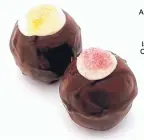  ??  ?? A new twist on an old favorite, cupcake dark chocolate truffles at Cocopotamu­s Chocolate.