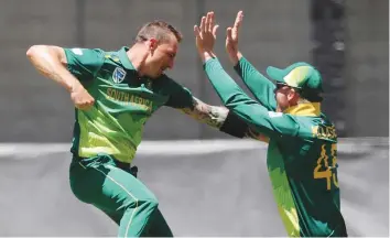  ?? AP ?? South Africa’s Dale Steyn (left) celebrates with Heinrich Klaasen after dismissing Australia’s D’Arcy Short during the first One Day Internatio­nal in Perth yesterday.