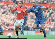  ??  ?? Manchester United's Ecuador midfielder Antonio Valencia (L) vies with Everton's French defender Sylvain Distin during the English Premier League football match between Manchester United and Everton at Old Trafford in Manchester, north-west England on...