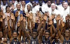  ?? THEMBA HADEBE / ASSOCIATED PRESS ?? NBA players, coaches and executives stand with South African young people at the
Johannesbu­rg. An NBA exhibition is to take place there today.