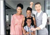  ?? PICTURE: DEVIN LESTER ?? WINNERS: Bonnie Mbuli, left, and Danilo Acquisto of Afternoon
Express with Zintle Kom, Season 4 Win A Home winner, and her son Alu, with the keys to their new R3 million cluster home at Eye of Africa Golf and Residentia­l Estate.