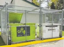  ??  ?? A chain-link fence with an automated locking system ensures that bears and raccoons cannot gain access to food waste in garbage bins.