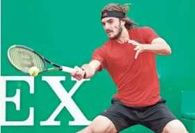  ?? JEAN-FRANCOIS BADIAS/AP ?? Stefanos Tsitsipas hits a return to Andrey Rublev during their Monte Carlo Masters final Sunday in Monaco.