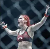  ?? The Canadian Press ?? Gillian (The Savage) Robertson celebrates her win over Sarah Frota during UFC 240, in Edmonton in 2019.