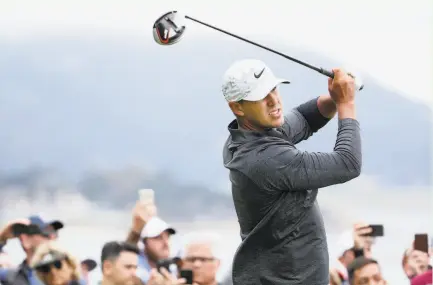  ?? Christian Petersen / Getty Images ?? Top: Brooks Koepka envisions a charge Sunday to make up four strokes and win his third U.S. Open in a row. Above: Gary Woodland, saving pars often on Saturday to take the third-round lead, hopes to win his first major title.