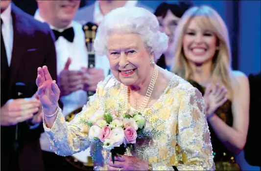  ?? Photo: VCG ?? Queen Elizabeth II waves as members of the Royal Family attend The Queen’s Birthday Party at the Royal Albert Hall, London, UK, on Saturday.