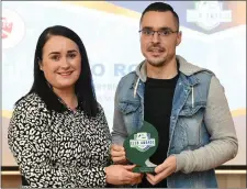  ??  ?? Shane Crossan of Sligo Rovers is presented with the Best Family Initiative award by Ruth Rapple, SSE Airtricity at the awards.