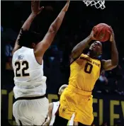  ?? ASSOCIATED PRESS ?? ARIZONA STATE GUARD Luguentz Dort (right) shoots against California’s Andre Kelly (22) during the first half of Wednesday’s game in Berkeley, Calif.
