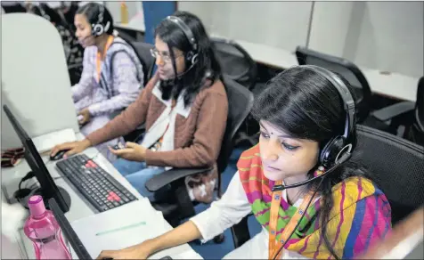  ?? PHOTO: TAYLOR WEIDMAN/BLOOMBERG ?? Employees wear headsets while working at the Avise Techno Solutions call centre in Kolkata, India, in this file photo. The developmen­t is an example what India can teach South Africa how to proceed with the creation of a national IT sector.
