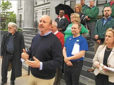  ?? ERIC DEVLIN — DIGITAL FIRST MEDIA ?? State Rep. Matt Bradford says a natural gas extraction tax is necessary to combat the inflating state deficit. He was joined by the Clear Coalition on Thursday on the steps of the Montgomery County Courthouse in Norristown.