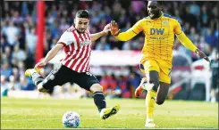  ??  ?? THREAT: Brentford’s Neal Maupay tries a shot