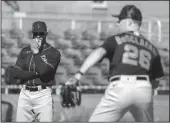  ?? DARRYL WEBB FOR BAY AREA NEWS GROUP ?? Giants manager Gabe Kapler watches as pitchers warm up on Thursday in Scottsdale, Ariz.